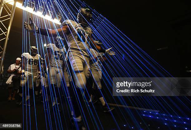 Brent Celek of the Philadelphia Eagles leads his team out of the tunnel before a football game against the Dallas Cowboys at Lincoln Financial Field...