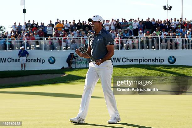 Jason Day of Australia celebrates winning the Final Round of the BMW Championship at Conway Farms Golf Club on September 20, 2015 in Lake Forest,...