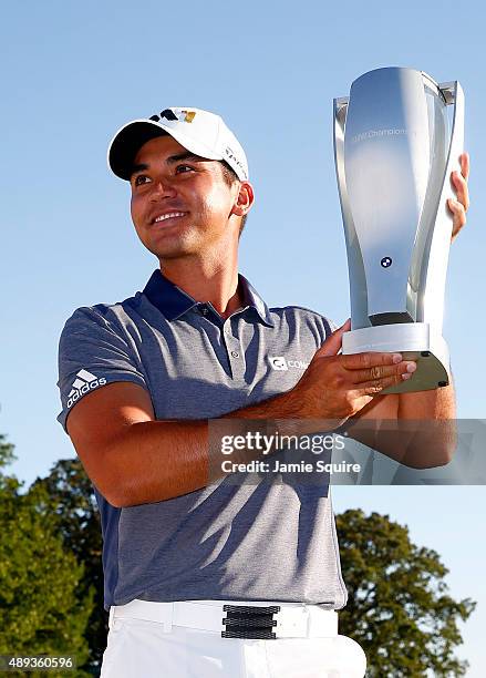 Jason Day of Australia celebrates with the winner's trophy after the Final Round of the BMW Championship at Conway Farms Golf Club on September 20,...