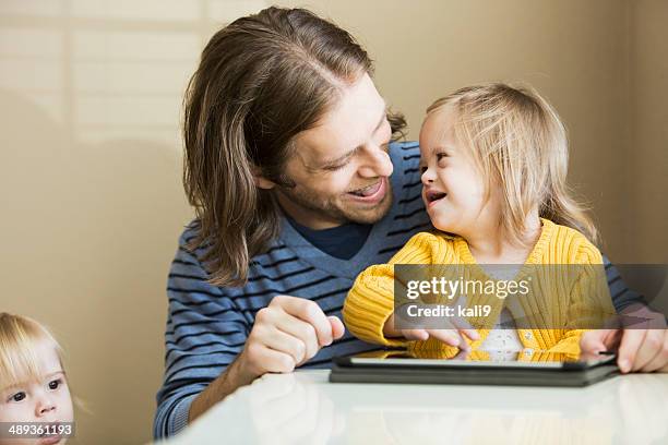 father and daughter with down syndrome - down syndrome care stockfoto's en -beelden