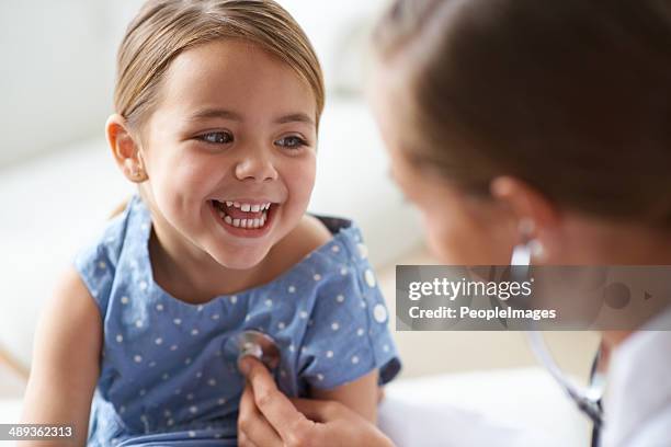 that tickles! - family doctor stockfoto's en -beelden