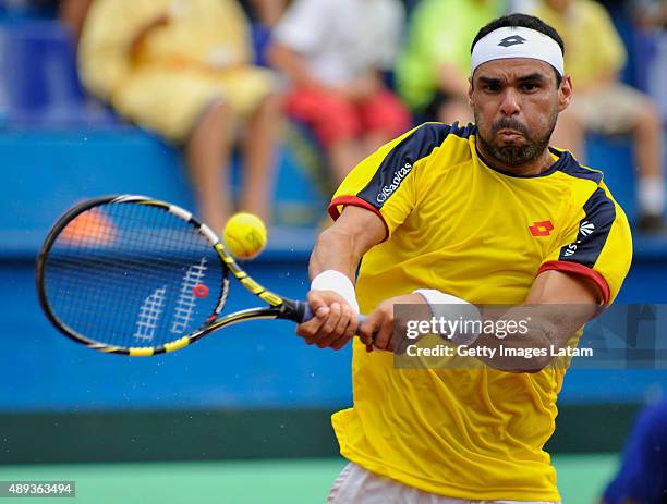 Alejandro Falla of Colombia returns a backhand shot during the Davis Cup World Group Play-off singles match between Alejandro Falla of Colombia and...