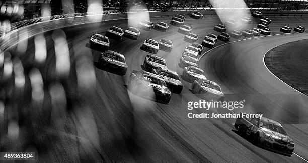 Kevin Harvick, driver of the Jimmy John's / Budweiser Chevrolet, leads a pack of cars during the NASCAR Sprint Cup Series myAFibRisk.com 400 at...