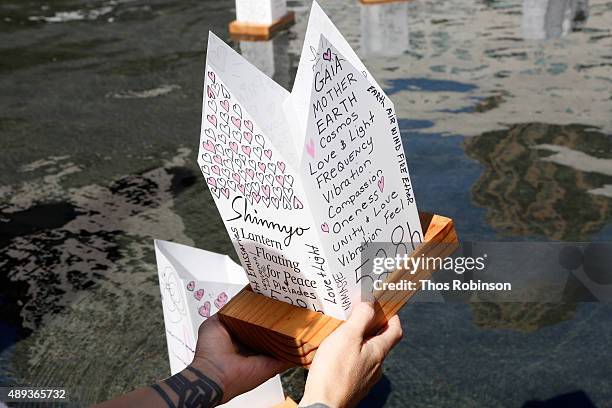 Guests participate in the Shinnyo Lantern Floating for Peace Ceremony at Lincoln Center for the Performing Arts on September 20, 2015 in New York...