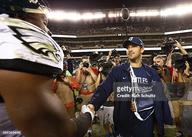 DeMeco Ryans of the Philadelphia Eagles shakes hands with Tony Romo of the Dallas Cowboys after their football game at Lincoln Financial Field on...