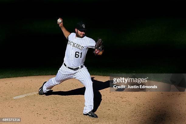 Relief pitcher David Hale of the Colorado Rockies delivers to home plate during the seventh inning against the San Diego Padres at Coors Field on...