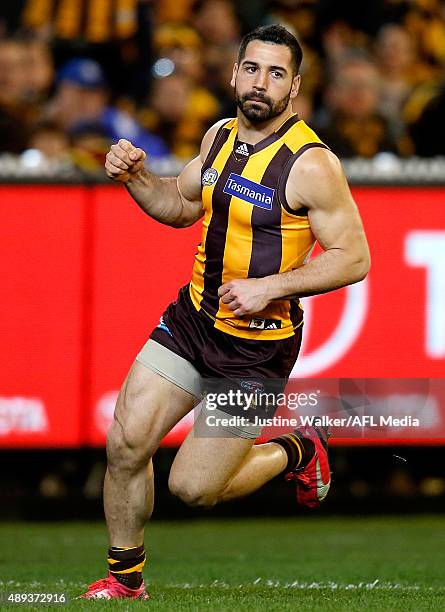 Paul Puopolo of the Hawks celebrates a goal during the 2015 AFL Second Semi Final match between the Hawthorn Hawks and the Adelaide Crows at the...