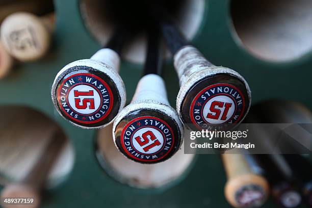 Bats belonging to Nate McLouth of the Washington Nationals sit in the bat rack in the dugout before the game against the Oakland Athletics at O.co...