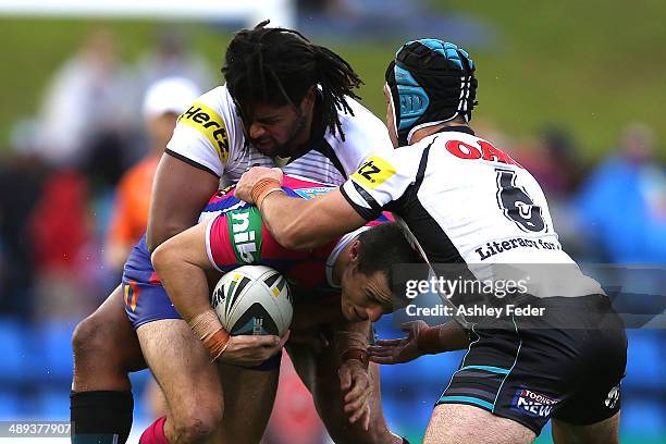 James McManus of the Knights is tackled by Jamal Idris of the Panthers during the round 9 NRL match between the Newcastle Knights and the Penrith...