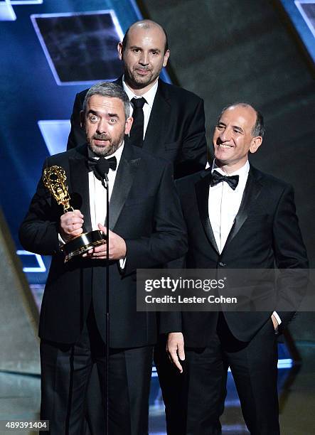 Veep" writers Simon Blackwell, Tony Roche and Armando Iannucci accept an award onstage during the 67th Annual Primetime Emmy Awards at Microsoft...