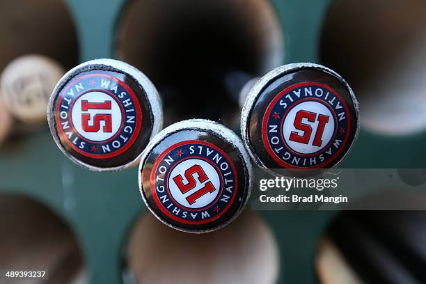 Bats belonging to Nate McLouth of the Washington Nationals sit in the bat rack in the dugout before the game against the Oakland Athletics at O.co...