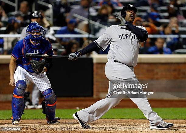 Sabathia of the New York Yankees reacts to striking out during the fifth inning in front of Travis d'Arnaud of the New York Mets at Citi Field on...
