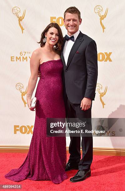 Megan Marie Coughlin and actor Philip Winchester attend the 67th Emmy Awards at Microsoft Theater on September 20, 2015 in Los Angeles, California....