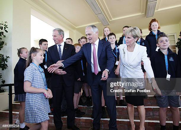 Prime Minister Malcolm Turnbull and Minister for Foreign Affairs Julie Bishop arrange a group photo with students from Penguin District School in...