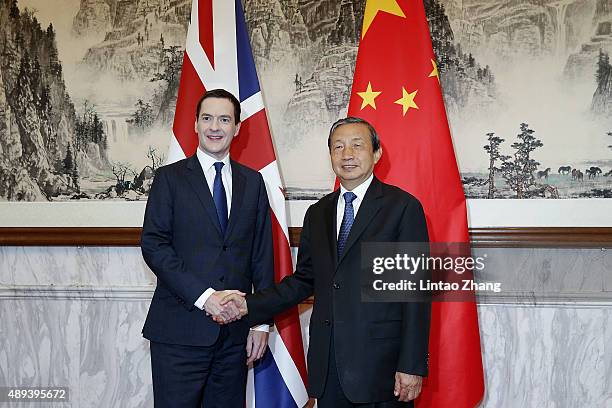 Chinese Vice President Ma Kai shakes hands with Chancellor of the Exchequer George Osborne before the 7th China-UK strategic economic dialogue at...