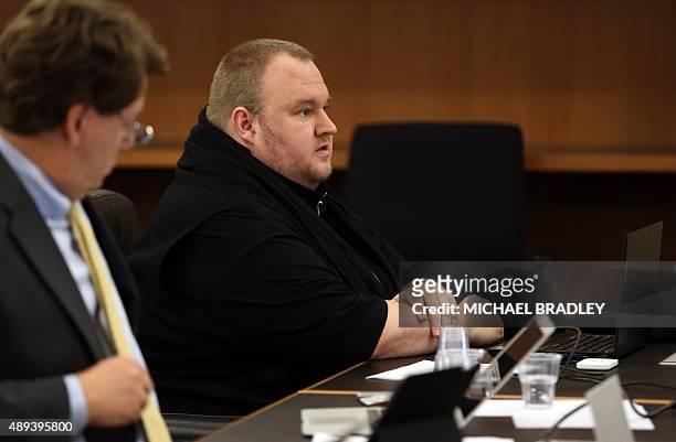 Megaupload founder Kim Dotcom looks on as he sits in court in Auckland on September 21 as he fights a US bid to extradite him from New Zealand....
