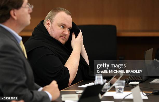 Megaupload founder Kim Dotcom reacts as he sits in court in Auckland on September 21 as he fights a US bid to extradite him from New Zealand....