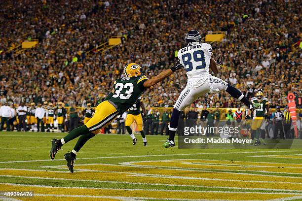Doug Baldwin of the Seattle Seahawks catches a touchdown pass from Russell Wilson in the third quarter against the Green Bay Packers during their...