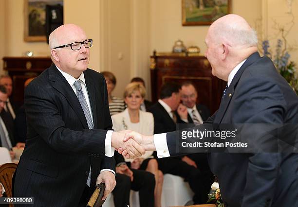 Leader of the Government in the Senate George Brandis is congratulated by Governor-General Sir Peter Cosgrove during the swearing-in ceremony of the...