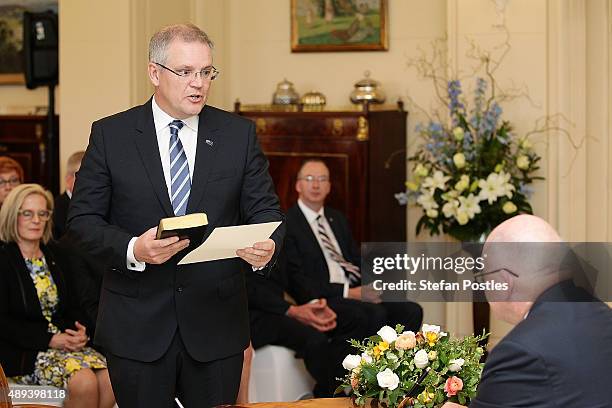 Treasurer Scott Morrison is sworn in by Governor-General Sir Peter Cosgrove during the swearing-in ceremony of the new Turnbull Government at...