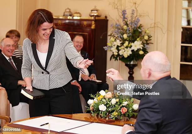 Assistant Minister for Agriculture and Water Resources Anne Ruston borrows the glasses of Governor-General Sir Peter Cosgrove during the swearing-in...