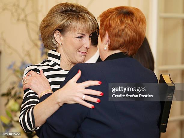 Defence Minister Marise Payne and Employment Minister, Minister for Women Michaelia Cash embrace prior to the swearing-in ceremony of the new...