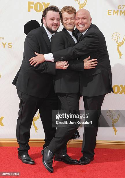 Actors John Bradley-West, Alfie Allen, and Conleth Hill arrive at the 67th Annual Primetime Emmy Awards at Microsoft Theater on September 20, 2015 in...