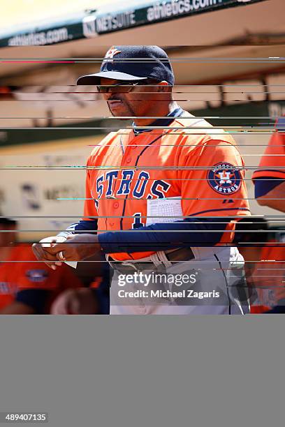 Manager Bo Porter of the Houston Astros stands in the dugout prior to the game against the Oakland Athletics at O.co Coliseum on April 19, 2014 in...