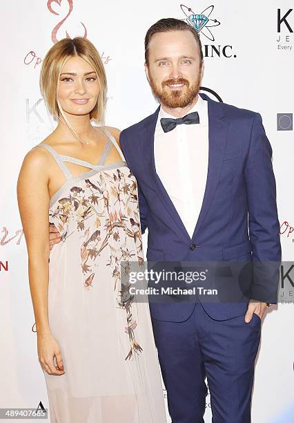 Aaron Paul and Lauren Parsekian arrive at the Open Hearts Foundation 4th Annual Gala held on May 10, 2014 in Malibu, California.