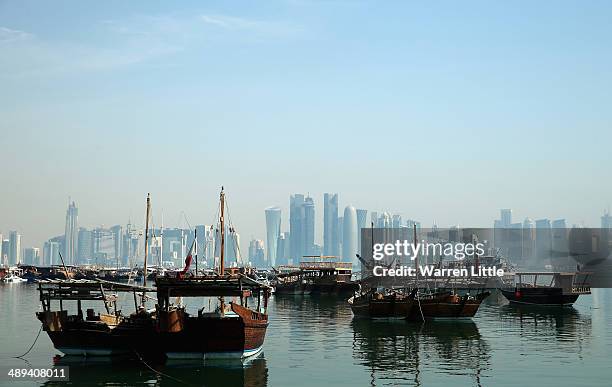 Dhows are pictured in the city of Doha on May 9, 2014 in Doha, Qatar.