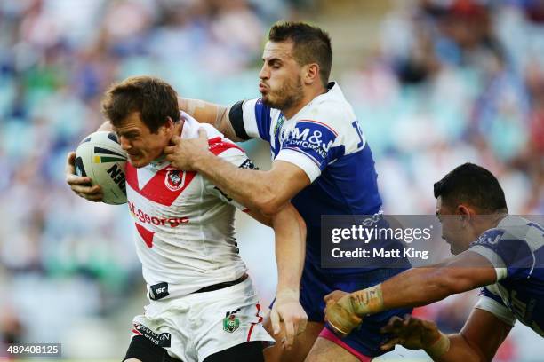 Brett Morris of the Dragons is tackled by Josh Reynolds of the Bulldogs during the round nine NRL match between the St George Illawarra Dragons and...