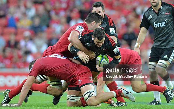 Corey Flynn of the Crusaders takes on the defence during the round 13 Super Rugby match between the Reds and the Crusaders at Suncorp Stadium on May...