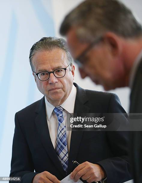 Frank-Juergen Weise , the newly-appointed head of Germany's Federal Office for Migration and Refugees , departs with German Interior Minister Thomas...