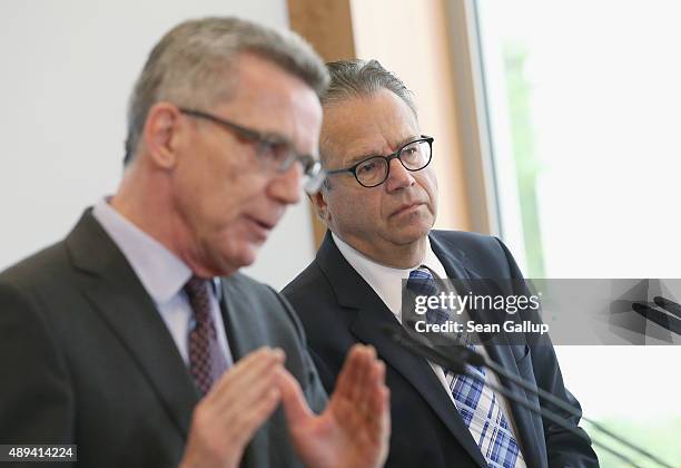 Frank-Juergen Weise , the newly-appointed head of Germany's Federal Office for Migration and Refugees , and German Interior Minister Thomas de...