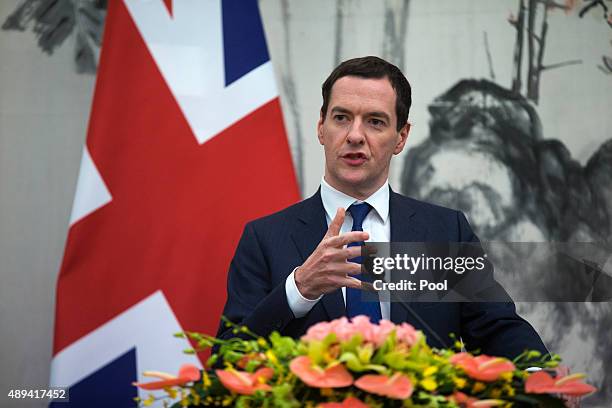 Britain's Chancellor of the Exchequer George Osborne speaks during a joint press conference with Chinese Vice President Ma Kai during the Seventh...