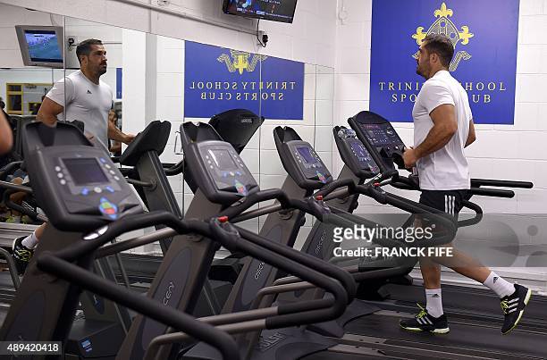 France's full back Scott Spedding runs on a tredmill during a recovering and training session at the Trinity School in Croydon, south of London, on...