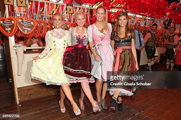 Jennifer Knaeble, Barbara Sturm, Monica Ivancan and Cathy Hummels attend the Regines Sixt Damen Wiesn during the Oktoberfest 2015 on September 21,...