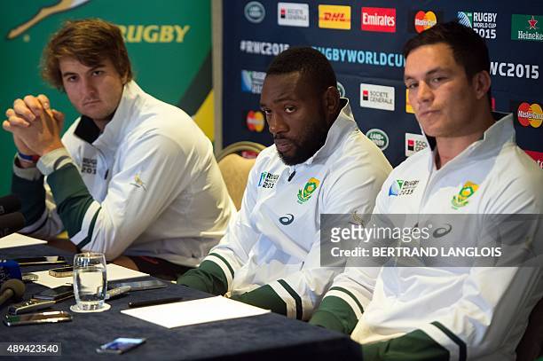 South Africa's lock Lood de Jager, South Africa's prop Tendai Mtawarira and South Africa's back row Francois Louw attend a press conference in...