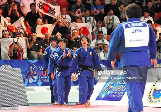 Japanese judoka celebrate winning the gold after beating Poland in the Women's Team final during the 2015 Astana World Judo Championships at the Alau...