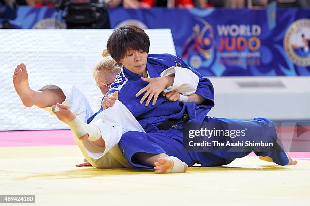 Miku Tashiro of Japan and Anna Borowska of Poland compete in the Women's Team final during the 2015 Astana World Judo Championships at the Alau Ice...