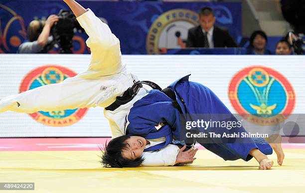 Misato Nakamura of Japan throws Karolina Pienkowska of Poland compete in the Women's Team final during the 2015 Astana World Judo Championships at...