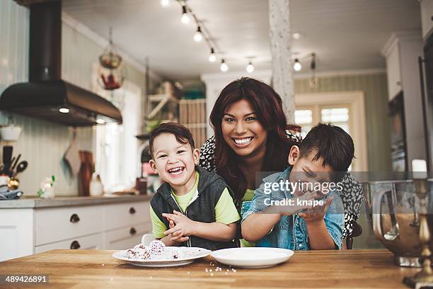 family in the kitchen baking - 3 year old stock pictures, royalty-free photos & images