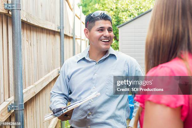 repairman or insurance agent examining homeowner's property - damaged fence stock pictures, royalty-free photos & images