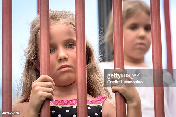 sad-little-girls-in-a-cage.jpg