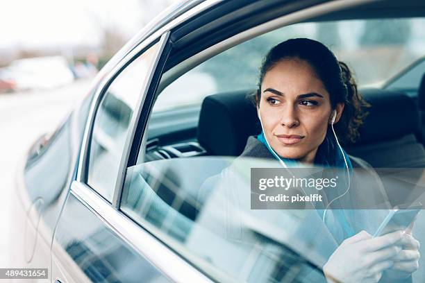 woman in car - motorheadphones stock pictures, royalty-free photos & images