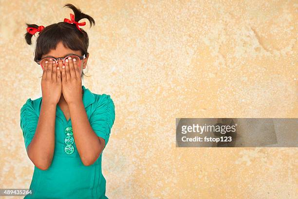 embarassed, guilty, nervous little girl with hands covering face. - trousers down stock pictures, royalty-free photos & images