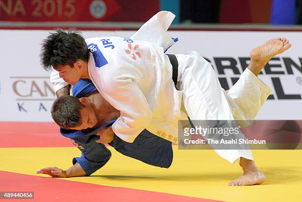 Shohei Ono of Japan throws Igor Wandtke of Germany in the Men's team semi final against Germany during the 2015 Astana World Judo Championships at...