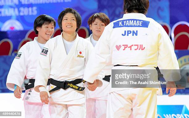 Japanese judoka celebrate winning the semi final after beating Mongolia in the Women's Team semi final during the 2015 Astana World Judo...