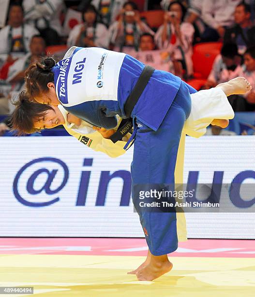 Chizuru Arai of Japan and Tserennadmid Tsend-Ayush of Mongolia compete in the Women's Team semi final during the 2015 Astana World Judo Championships...