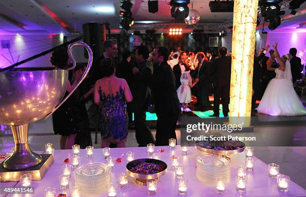 Iranian families take part in a luxury wedding with mixed dancing and removal of headscarves, at a private garden tailor-made for the purpose west of...